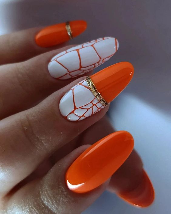 paznokcie pomarańczowe z wzorem
