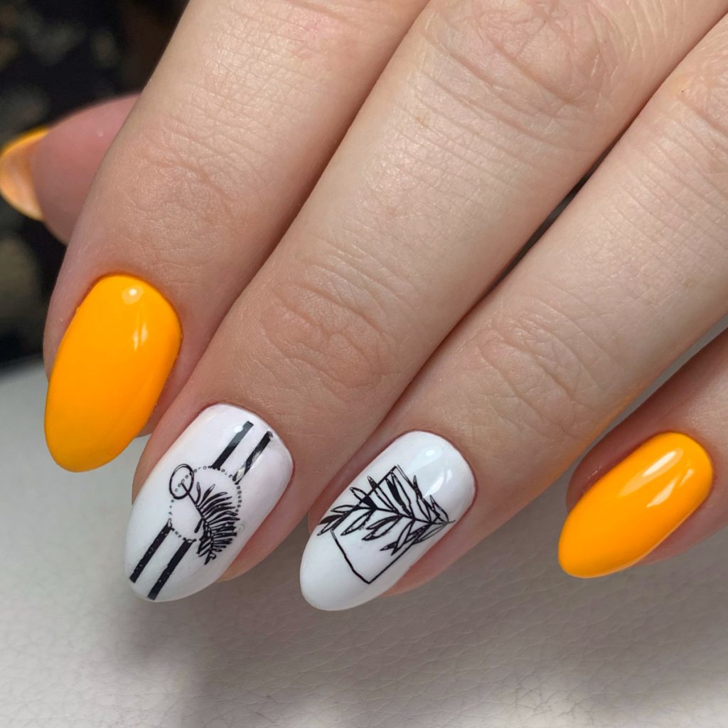paznokcie pomarańczowe z wzorkami białymi