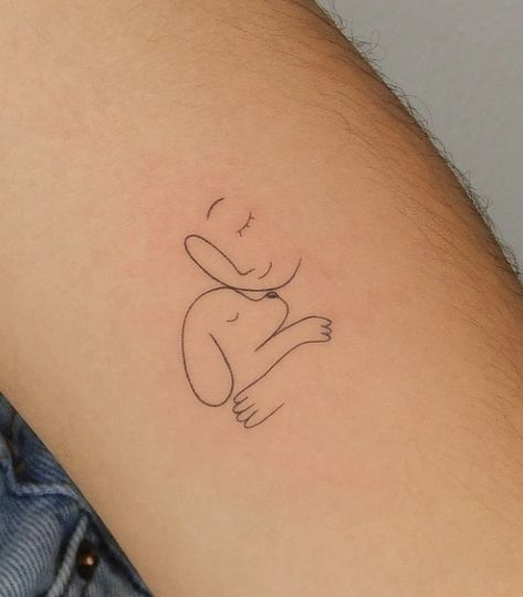 Minimalistyczne tatuaże z psem z buzią