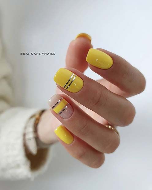 żółte paznokcie ze złotym paskiem